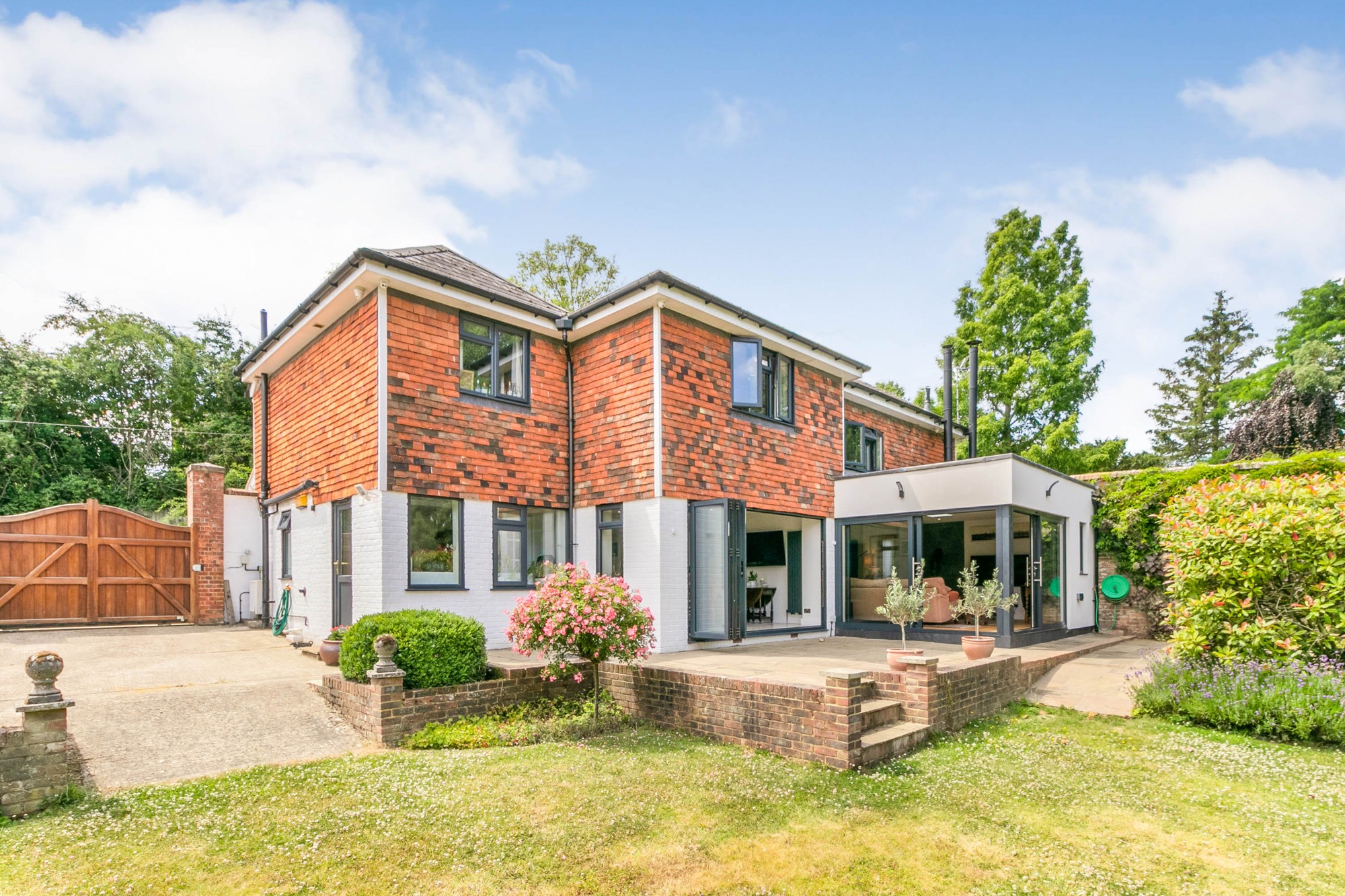 Home extension & refurbishment in Tenterden after two extensions and a whole-house refurbishment, viewed from the garden