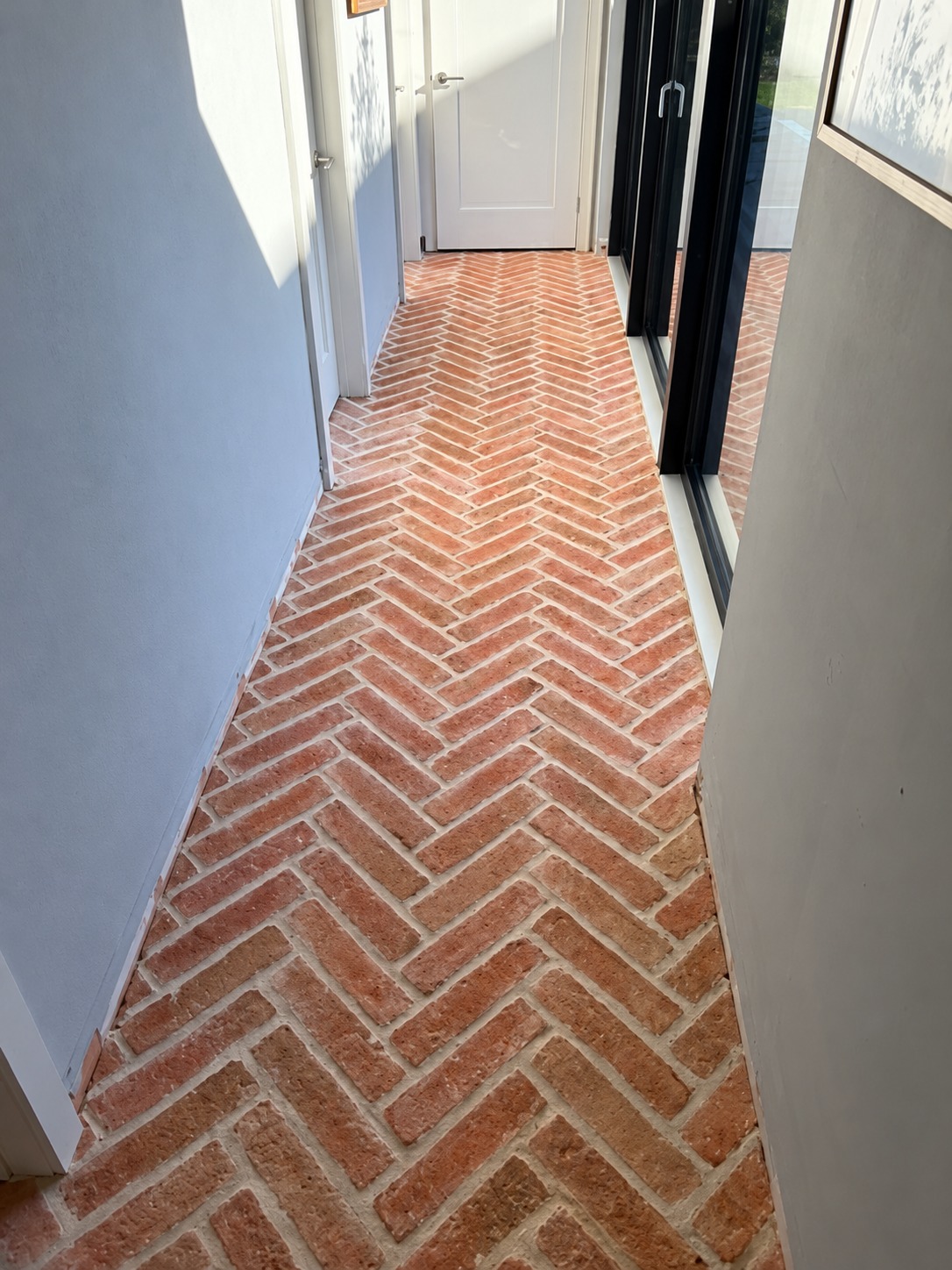 Herringbone brick-slip floor with lime mortar pointing in Battle